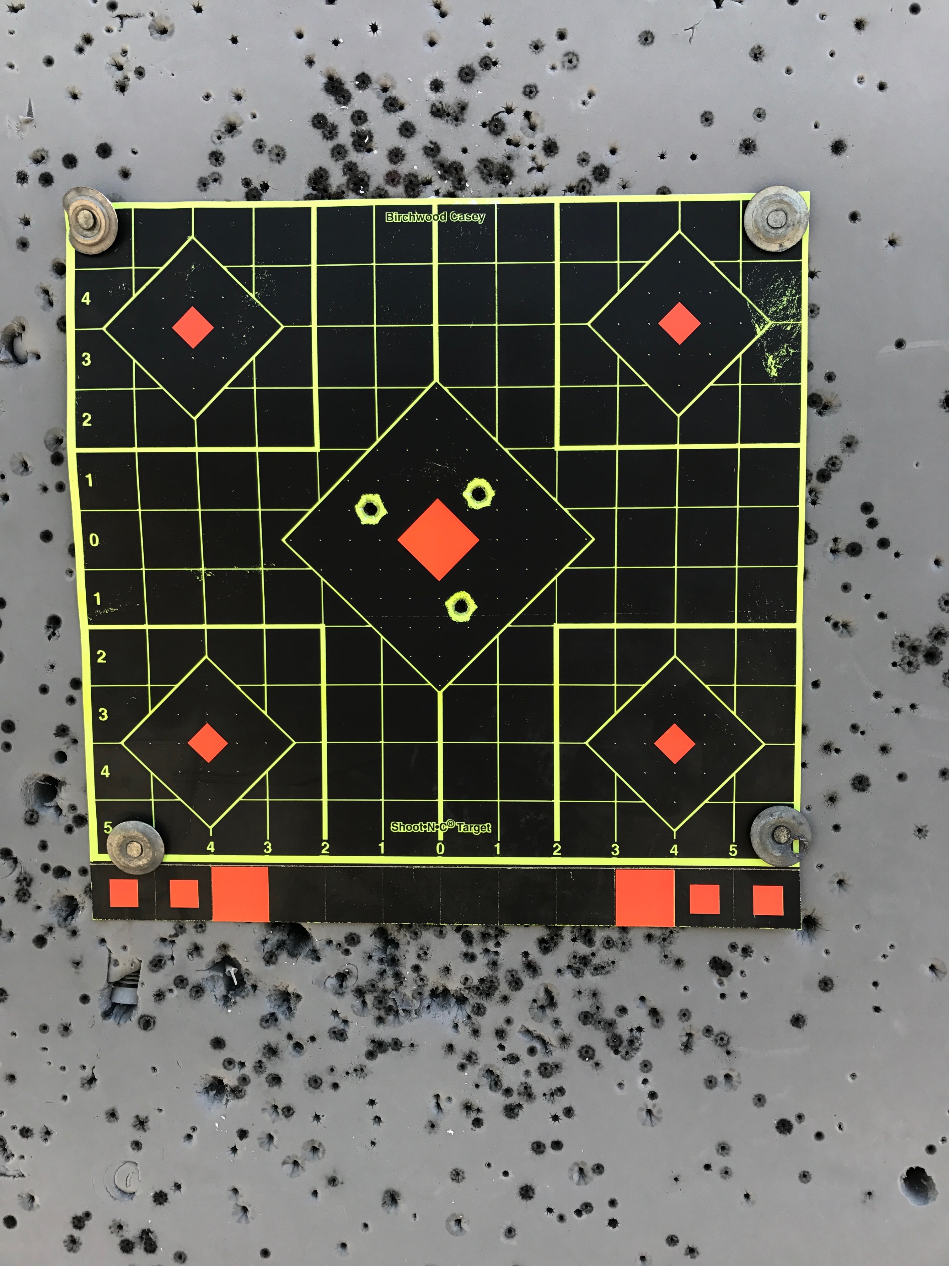 First three shots from bench at 53 yards (1 x 1&quot; red center target).  Without 8 power binoculars, I had no idea!