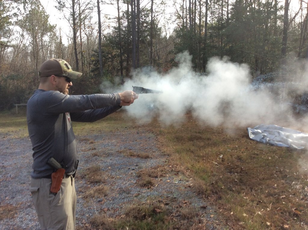 Chad drops the hammer on the BP .45 Colt load.jpg