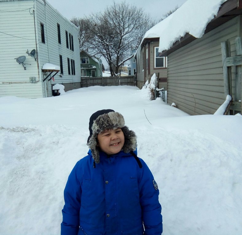 Virgin snow is up to his chest. He's about 4ft