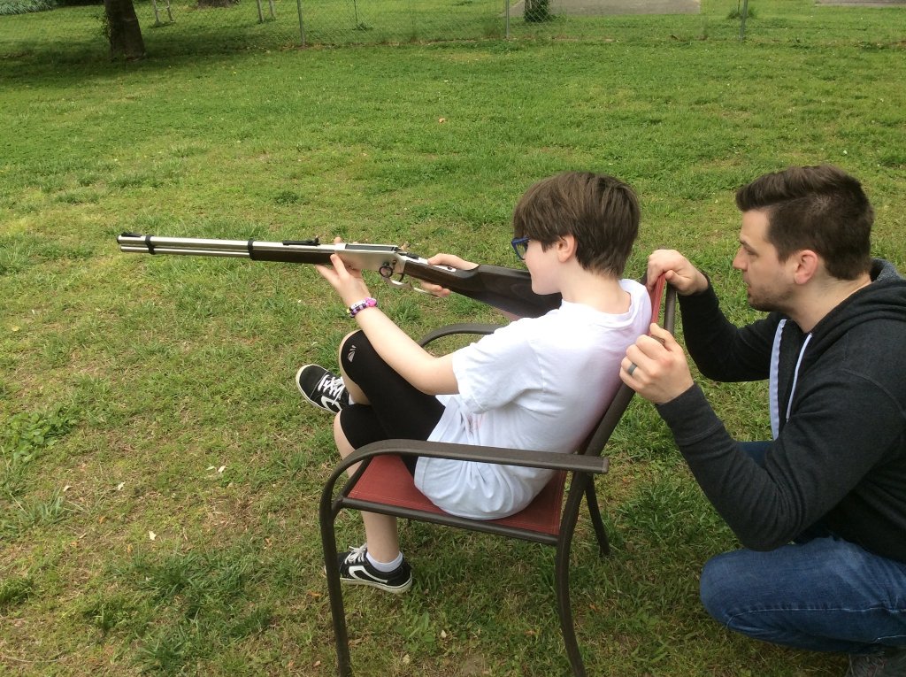 Chad helping Macie line up the 177 Walther on target.jpg