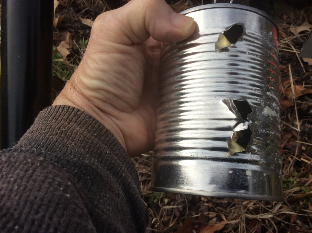 Three 30 cal shots in can   exit holes.jpg