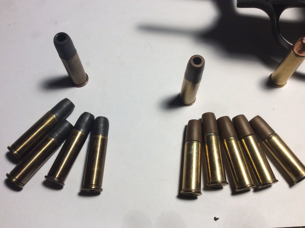 dan wesson shells to the right and mine to left.jpg