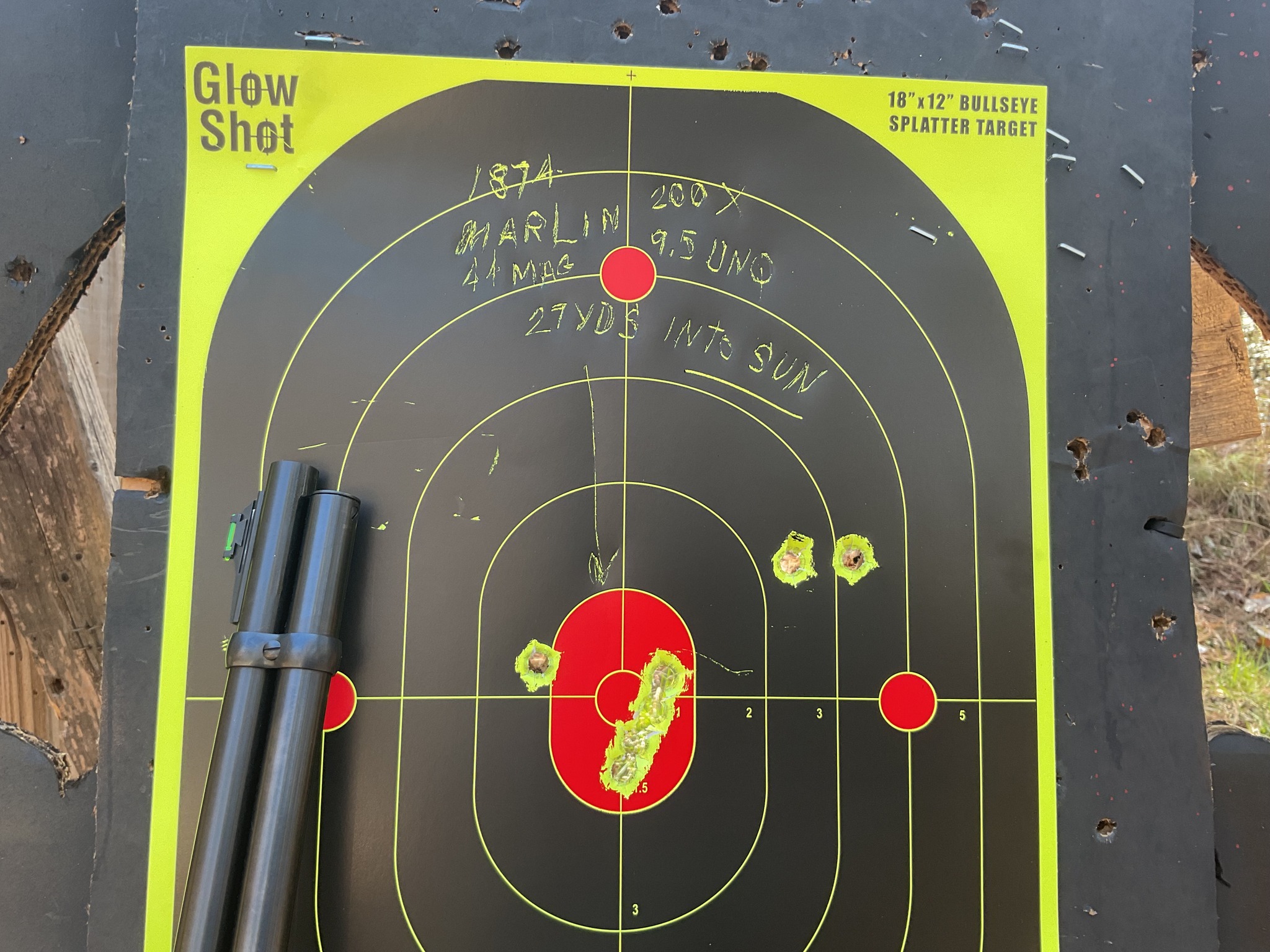 27 yd. ditance to see where shots hit and a sight adjut to get on center. Shooting into the sun glare..jpg