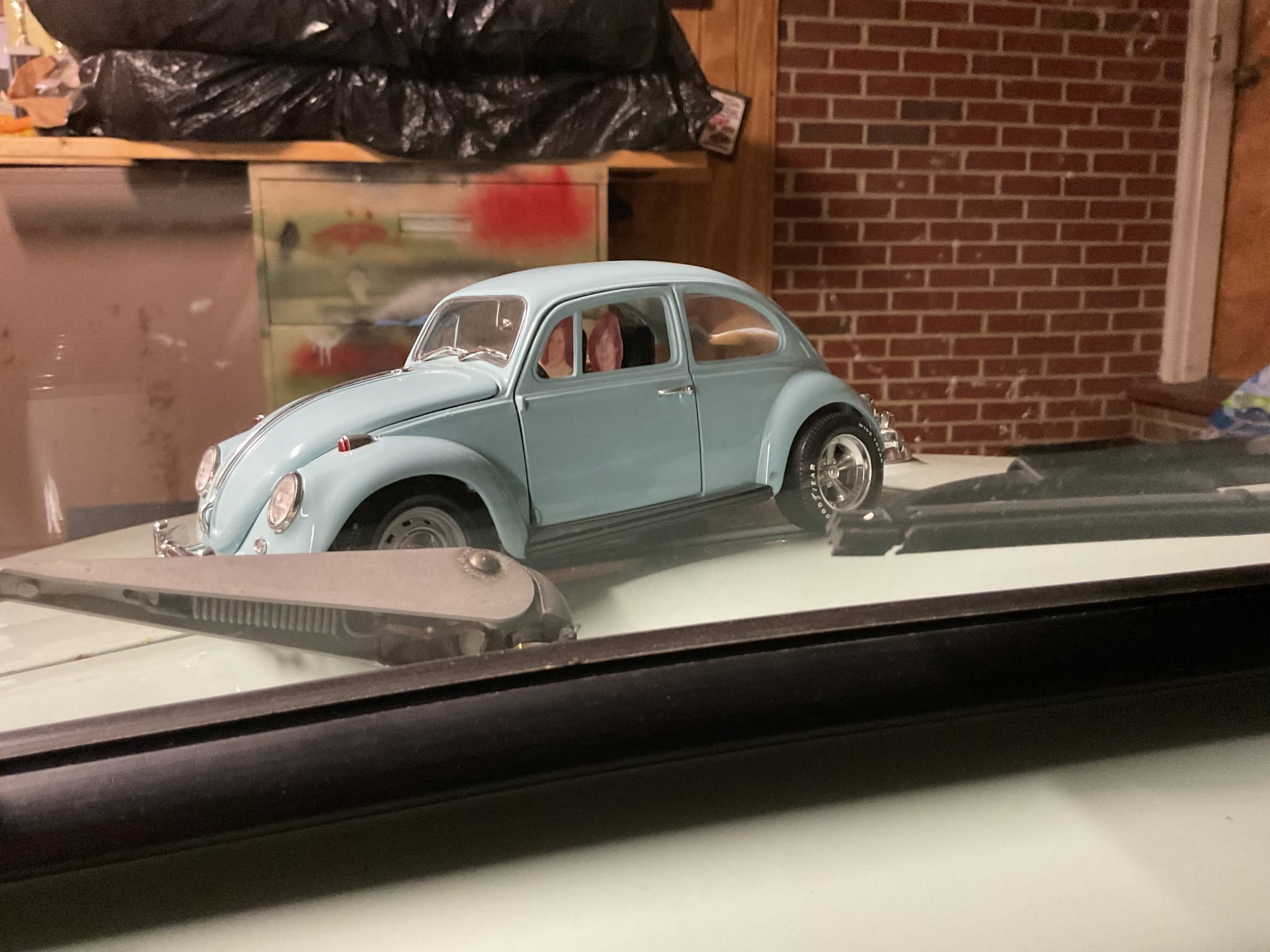 sitting in my VW looking back at myself 54 years ago.jpg