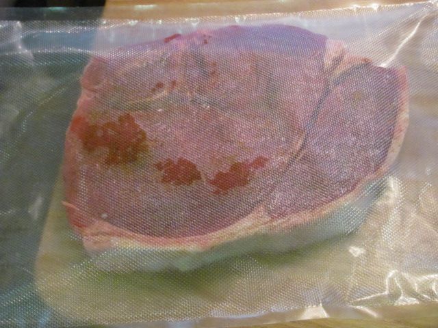 seasoned steak placed in the bag